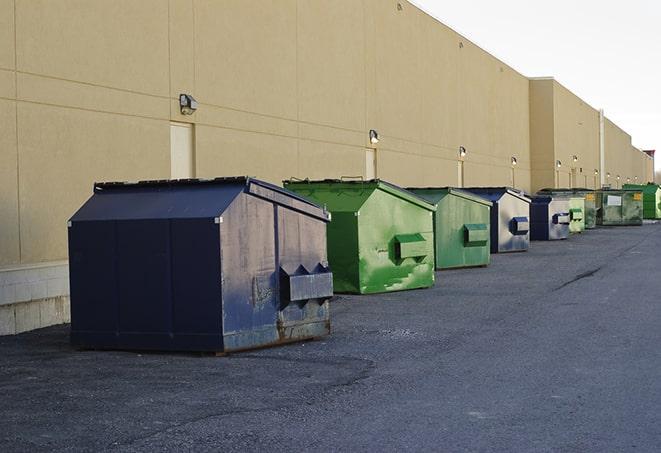 red and green waste bins at a building project in Dayton